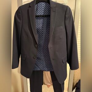 14 year old formal navy suit in perfect condition worn once .